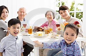 Asian family having dinnerÂ at home